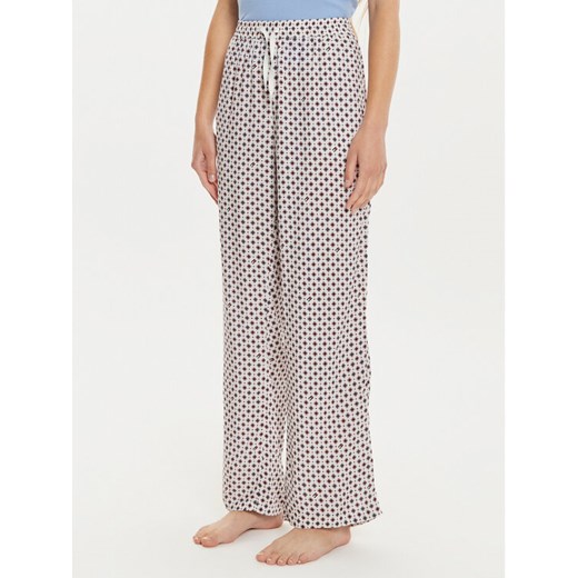 Tommy Hilfiger Spodnie piżamowe UW0UW05225 Écru Regular Fit ze sklepu MODIVO w kategorii Piżamy damskie - zdjęcie 182604829