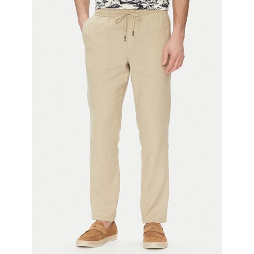 Tommy Hilfiger Spodnie materiałowe Harlem MW0MW38801 Beżowy Slim Fit ze sklepu MODIVO w kategorii Spodnie męskie - zdjęcie 182605025