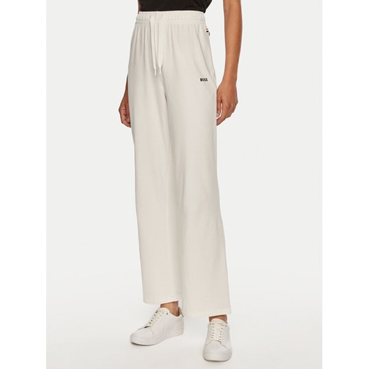 Boss Spodnie dresowe 50520148 Écru Relaxed Fit ze sklepu MODIVO w kategorii Spodnie damskie - zdjęcie 182605586