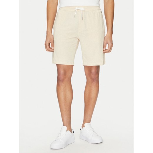 Tommy Hilfiger Szorty sportowe UM0UM03364 Beżowy Regular Fit ze sklepu MODIVO w kategorii Spodenki męskie - zdjęcie 182607887
