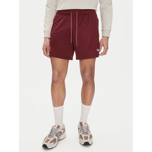 adidas Szorty sportowe FC Bayern Terrace JF0598 Czerwony Loose Fit ze sklepu MODIVO w kategorii Spodenki męskie - zdjęcie 182608116