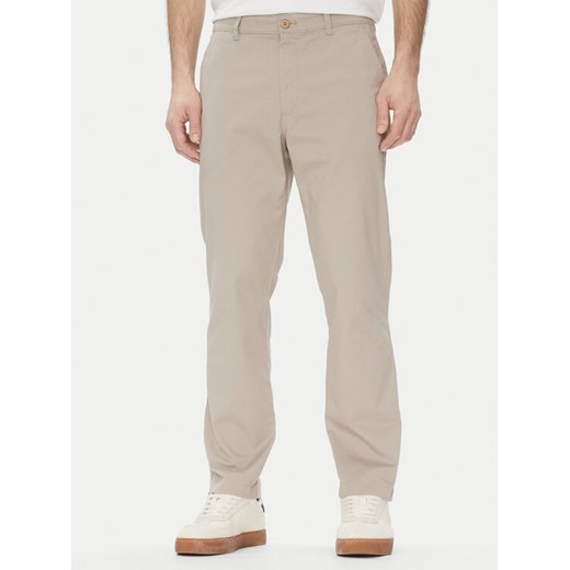 Calvin Klein Jeans Chinosy LV040EM628 Beżowy Slim Fit ze sklepu MODIVO w kategorii Spodnie męskie - zdjęcie 182608215