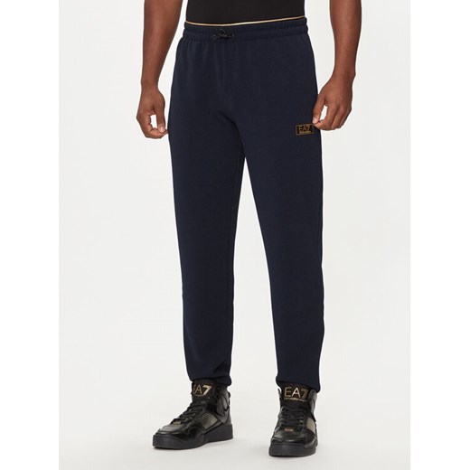 EA7 Emporio Armani Spodnie dresowe 7M000030 AF10344 UB102 Granatowy Regular Fit ze sklepu MODIVO w kategorii Spodnie męskie - zdjęcie 182610199