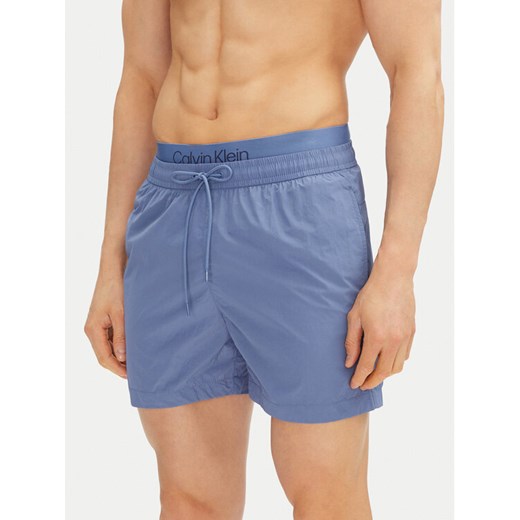Calvin Klein Swimwear Szorty kąpielowe KM0KM01104 Niebieski Regular Fit ze sklepu MODIVO w kategorii Kąpielówki - zdjęcie 182615045