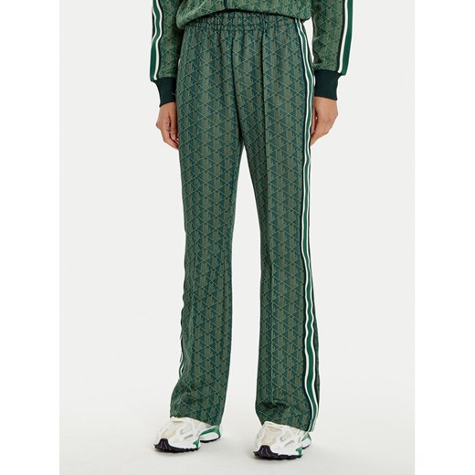 Lacoste Spodnie dresowe XF9313 Zielony Regular Fit ze sklepu MODIVO w kategorii Spodnie damskie - zdjęcie 182615759
