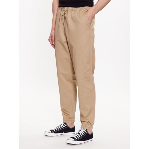 Converse Joggery Star Chevron 10024606-A02 Beżowy Regular Fit ze sklepu MODIVO w kategorii Spodnie męskie - zdjęcie 182616635