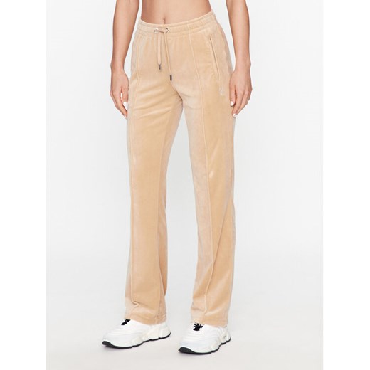 Juicy Couture Spodnie dresowe Tina JCAPW045 Beżowy Regular Fit ze sklepu MODIVO w kategorii Spodnie damskie - zdjęcie 182616947