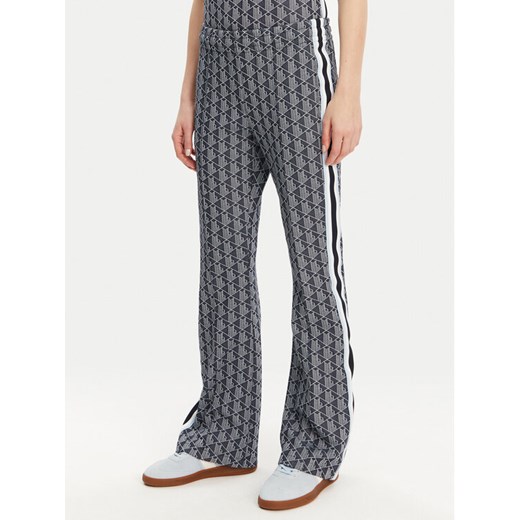 Lacoste Spodnie dresowe XF9313 Granatowy Regular Fit ze sklepu MODIVO w kategorii Spodnie damskie - zdjęcie 182621406