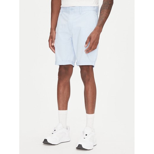 Tommy Jeans Szorty materiałowe Scanton DM0DM21950 Błękitny Slim Fit ze sklepu MODIVO w kategorii Spodenki męskie - zdjęcie 182621475