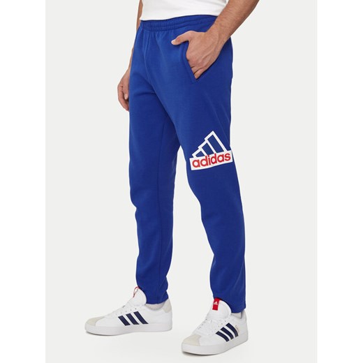 adidas Spodnie dresowe Future Icons Badge of Sport IS9594 Niebieski Regular Fit ze sklepu MODIVO w kategorii Spodnie męskie - zdjęcie 182621905