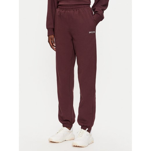 Athlecia Spodnie dresowe Giannis W Sweat EA243382 Bordowy Regular Fit ze sklepu MODIVO w kategorii Spodnie damskie - zdjęcie 182622177