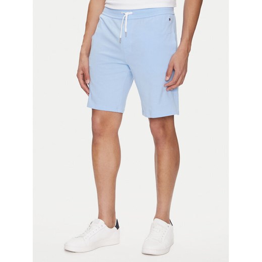 Tommy Hilfiger Szorty sportowe UM0UM03364 Błękitny Regular Fit ze sklepu MODIVO w kategorii Spodenki męskie - zdjęcie 182622179