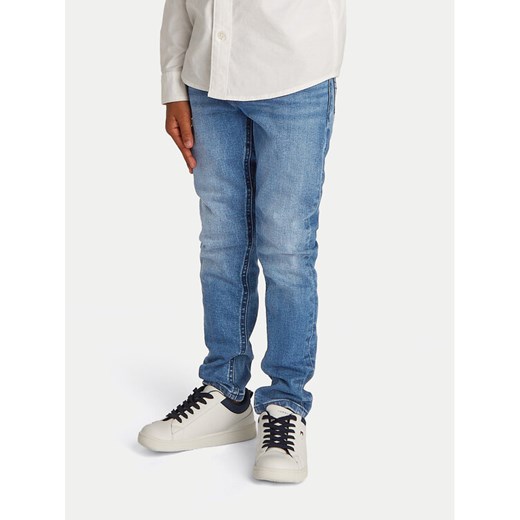 Tommy Hilfiger Jeansy Scanton KB0KB09566 Niebieski Slim Fit ze sklepu MODIVO w kategorii Spodnie chłopięce - zdjęcie 182622385