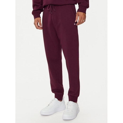 United Colors Of Benetton Spodnie dresowe 342ZUF01B Fioletowy Regular Fit ze sklepu MODIVO w kategorii Spodnie męskie - zdjęcie 182625128