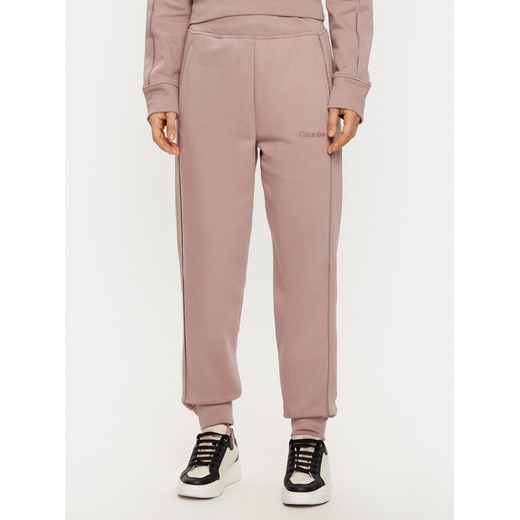 Calvin Klein Underwear Spodnie dresowe Jogger 000QS7286E Beżowy Regular Fit ze sklepu MODIVO w kategorii Spodnie damskie - zdjęcie 182626415