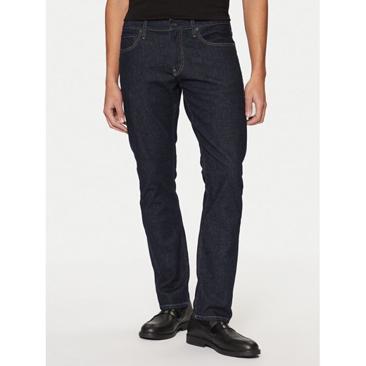 Calvin Klein Jeansy K10K111241 Granatowy Slim Fit ze sklepu MODIVO w kategorii Jeansy męskie - zdjęcie 182626498