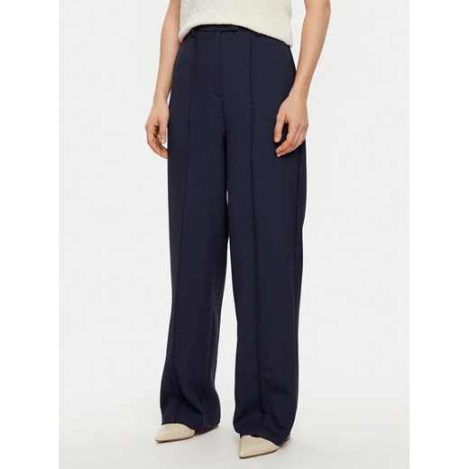 Tommy Hilfiger Spodnie materiałowe WW0WW43875 Granatowy Regular Fit ze sklepu MODIVO w kategorii Spodnie damskie - zdjęcie 182628215