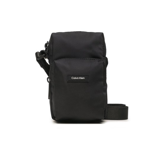 Calvin Klein Saszetka Ck Must T Reporter Xs K50K510570 Czarny ze sklepu MODIVO w kategorii Saszetki - zdjęcie 182628938