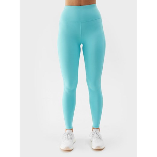 4F Legginsy 4FWSS24TFTIF232 Niebieski Slim Fit ze sklepu MODIVO w kategorii Spodnie damskie - zdjęcie 182629297