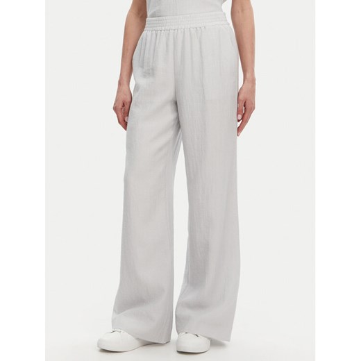 Calvin Klein Spodnie materiałowe K20K208173 Błękitny Regular Fit ze sklepu MODIVO w kategorii Spodnie damskie - zdjęcie 182630269