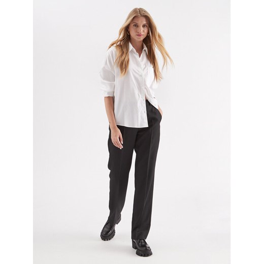 Calvin Klein Spodnie materiałowe Essential K20K206879 Czarny Slim Fit ze sklepu MODIVO w kategorii Spodnie damskie - zdjęcie 182630467