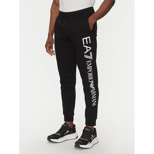 EA7 Emporio Armani Spodnie dresowe 7M000572 AF10377 MC001 Czarny Regular Fit ze sklepu MODIVO w kategorii Spodnie męskie - zdjęcie 182631367
