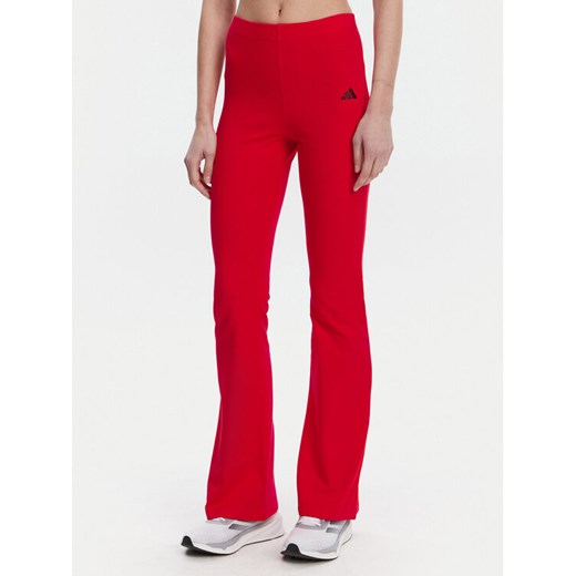 adidas Legginsy Essentials Small Logo JD3074 Czerwony Flare Fit ze sklepu MODIVO w kategorii Spodnie damskie - zdjęcie 182632448