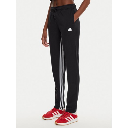adidas Spodnie dresowe Dance All-Gender IN1830 Czarny Regular Fit ze sklepu MODIVO w kategorii Spodnie damskie - zdjęcie 182632619