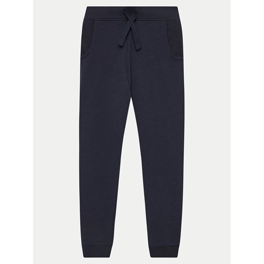 Guess Spodnie dresowe L93Q24 KAUG0 Granatowy Relaxed Fit ze sklepu MODIVO w kategorii Spodnie chłopięce - zdjęcie 182635689