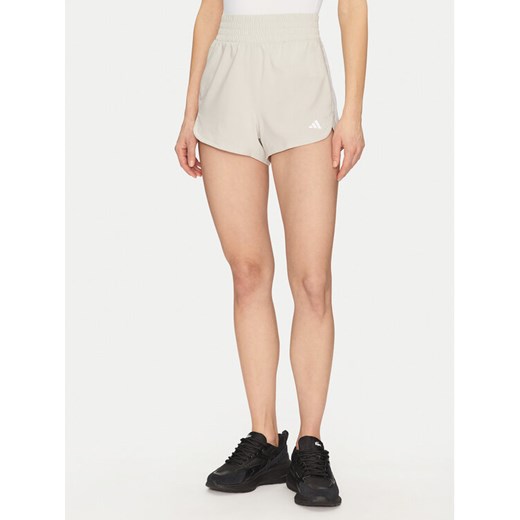 adidas Szorty sportowe Pacer Training 3-Stripes JD2295 Beżowy Regular Fit ze sklepu MODIVO w kategorii Szorty - zdjęcie 182636045