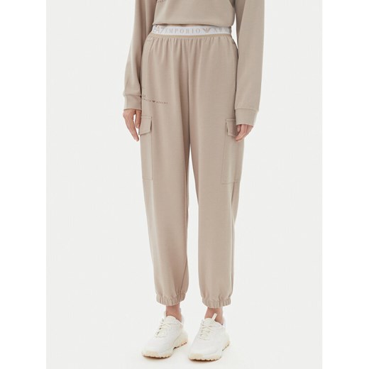 EA7 Emporio Armani Spodnie dresowe 7W000282 AF12501 U6155 Beżowy Loose Fit ze sklepu MODIVO w kategorii Spodnie damskie - zdjęcie 182636066