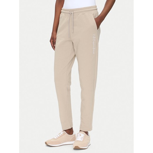 EA7 Emporio Armani Spodnie dresowe 7W000489 AF12951 U6155 Beżowy Regular Fit ze sklepu MODIVO w kategorii Spodnie damskie - zdjęcie 182637787