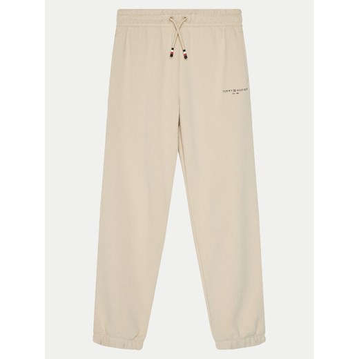 Tommy Hilfiger Spodnie dresowe KS0KS00596 Beżowy Regular Fit ze sklepu MODIVO w kategorii Spodnie dziewczęce - zdjęcie 182637846