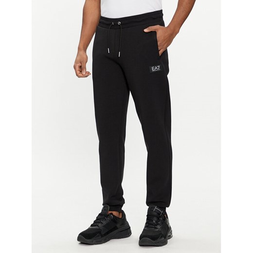 EA7 Emporio Armani Spodnie dresowe 3DPP77 PJUEZ 1200 Czarny Regular Fit ze sklepu MODIVO w kategorii Spodnie męskie - zdjęcie 182637969