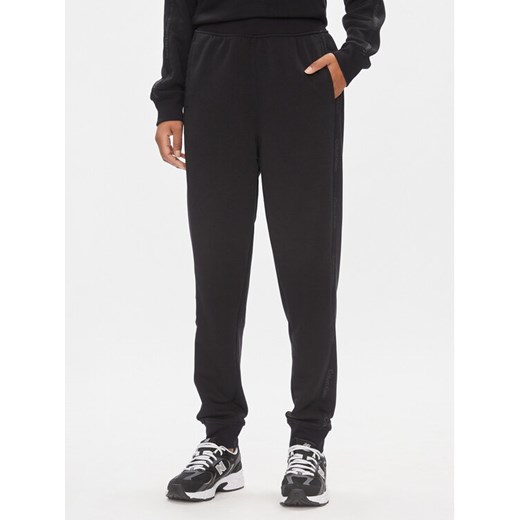 Calvin Klein Performance Spodnie dresowe 00GWS4P656 Czarny Relaxed Fit ze sklepu MODIVO w kategorii Spodnie damskie - zdjęcie 182638128