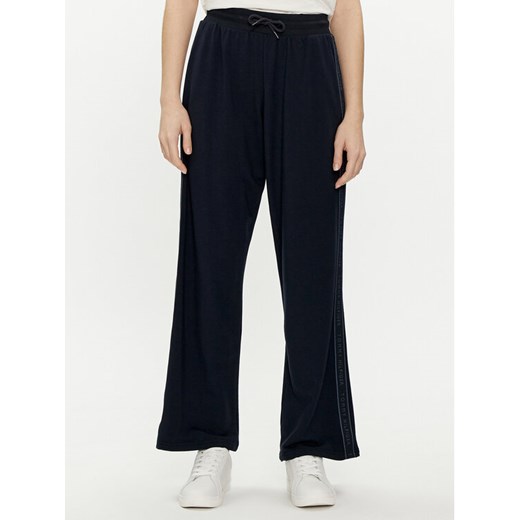 Tommy Hilfiger Spodnie dresowe UW0UW04771 Granatowy Relaxed Fit ze sklepu MODIVO w kategorii Spodnie damskie - zdjęcie 182644356