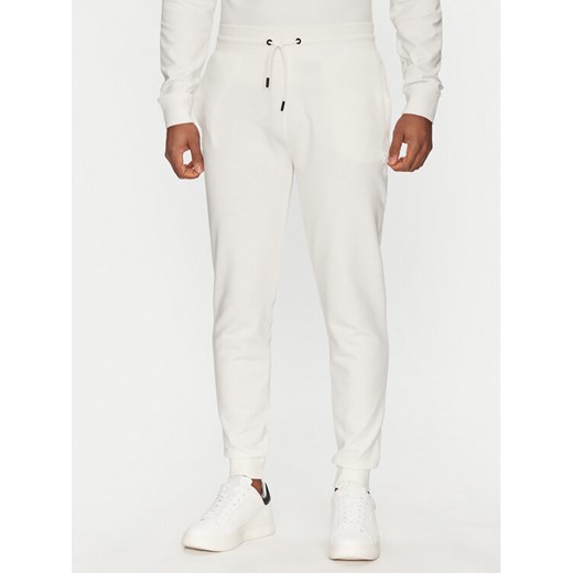 Guess Spodnie dresowe Z2YB22 KAIJ1 Biały Regular Fit ze sklepu MODIVO w kategorii Spodnie męskie - zdjęcie 182644965