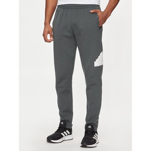 adidas Spodnie dresowe Future Icons Badge of Sport IR9177 Szary Regular Fit ze sklepu MODIVO w kategorii Spodnie męskie - zdjęcie 182646138