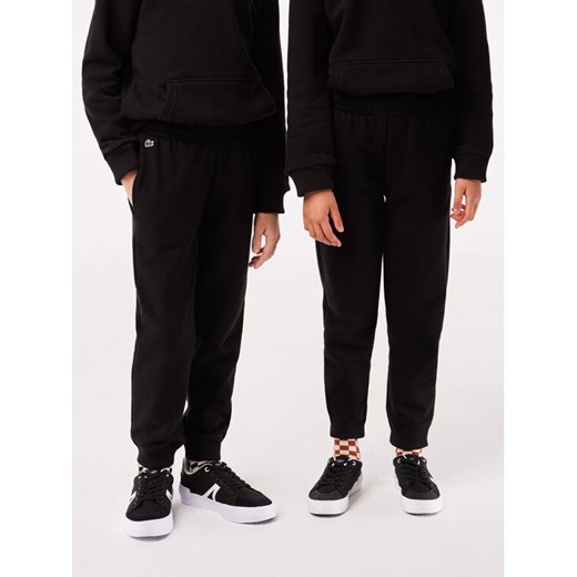 Lacoste Spodnie dresowe XJ9728 Czarny Regular Fit ze sklepu MODIVO w kategorii Spodnie chłopięce - zdjęcie 182647656