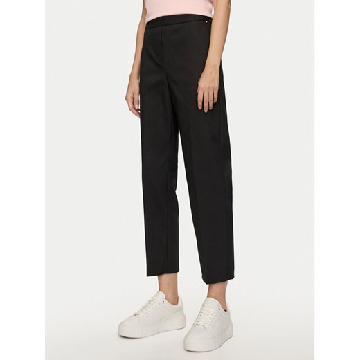 Tommy Hilfiger Chinosy Travel WW0WW43632 Czarny Slim Fit ze sklepu MODIVO w kategorii Spodnie damskie - zdjęcie 182649948