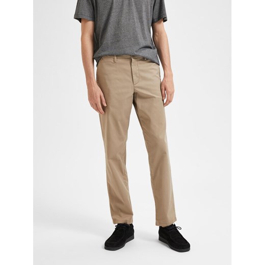 Selected Homme Spodnie materiałowe New 16087665 Beżowy Regular Fit ze sklepu MODIVO w kategorii Spodnie męskie - zdjęcie 182650268