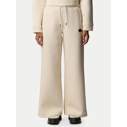 The North Face Spodnie dresowe NF0A8C25 Beżowy Wide Leg ze sklepu MODIVO w kategorii Spodnie damskie - zdjęcie 182650306
