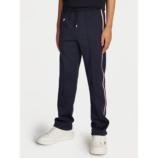 Tommy Hilfiger Spodnie dresowe Global Stripe KB0KB09383 Granatowy Regular Fit ze sklepu MODIVO w kategorii Spodnie chłopięce - zdjęcie 182653378