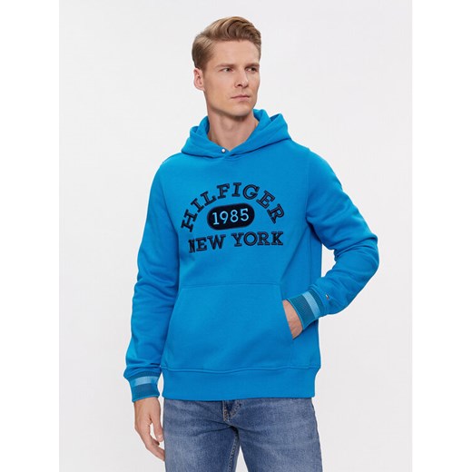 Tommy Hilfiger Bluza Collegiate MW0MW32682 Niebieski Regular Fit ze sklepu MODIVO w kategorii Bluzy męskie - zdjęcie 182653618