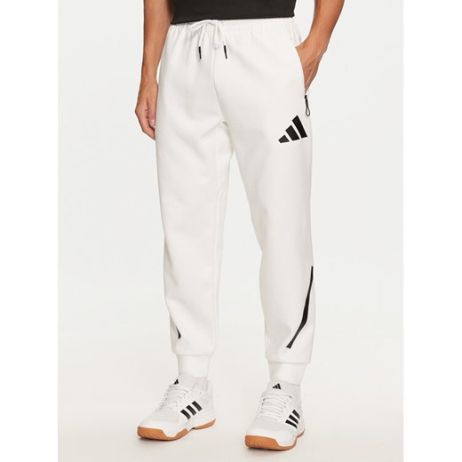 adidas Spodnie dresowe Z.N.E. JF2449 Biały Regular Fit ze sklepu MODIVO w kategorii Spodnie męskie - zdjęcie 182654087