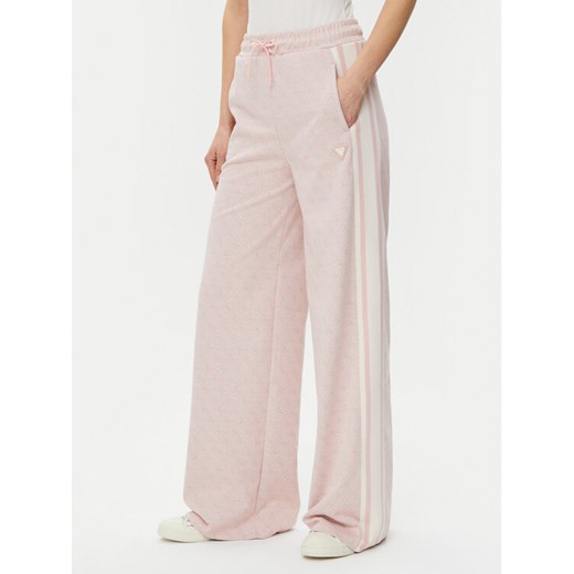 Guess Spodnie dresowe V5RB03 KCO90 Różowy Regular Fit ze sklepu MODIVO w kategorii Spodnie damskie - zdjęcie 182655178
