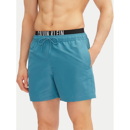 Calvin Klein Swimwear Szorty kąpielowe KM0KM01093 Niebieski Regular Fit ze sklepu MODIVO w kategorii Kąpielówki - zdjęcie 182655597