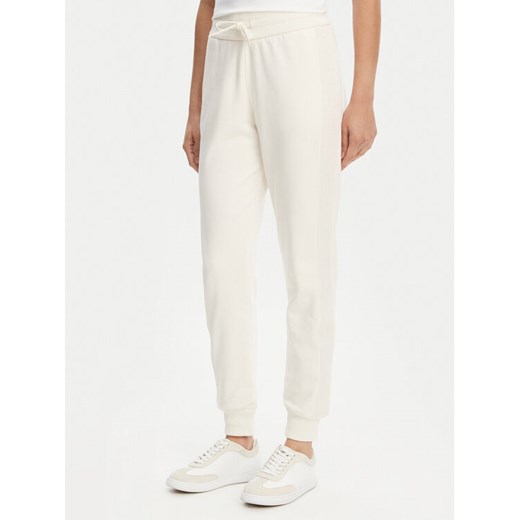 Armani Exchange Spodnie dresowe XW000503 AF12804 U1003 Écru Regular Fit ze sklepu MODIVO w kategorii Spodnie damskie - zdjęcie 182655836