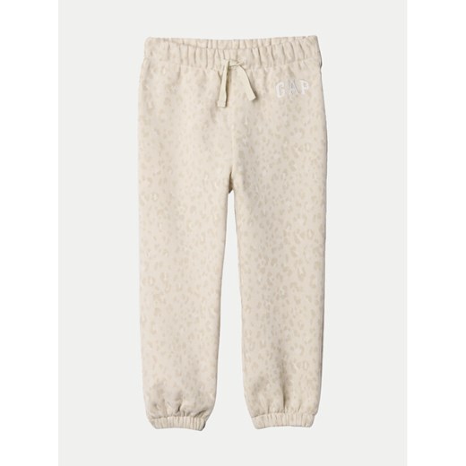 Gap Spodnie dresowe 635490 Écru Regular Fit ze sklepu MODIVO w kategorii Spodnie dziewczęce - zdjęcie 182656945