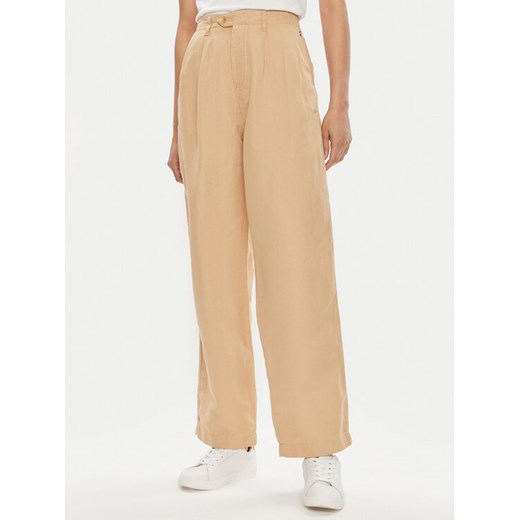 Tommy Hilfiger Spodnie materiałowe WW0WW41355 Beżowy Relaxed Fit ze sklepu MODIVO w kategorii Spodnie damskie - zdjęcie 182658607